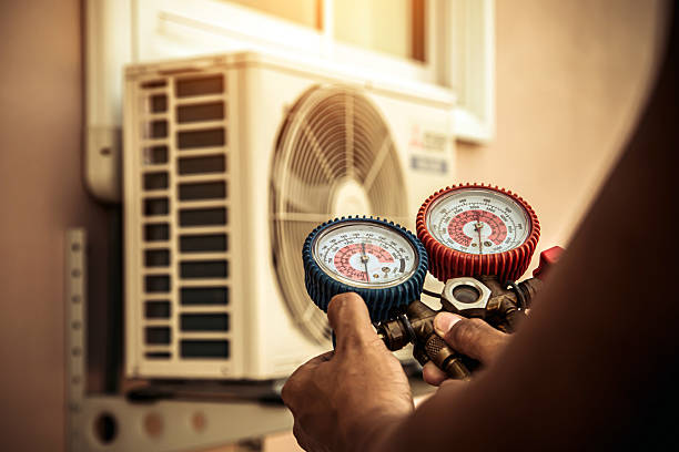Professional Air Conditioning Service technician working in Otisville, MI